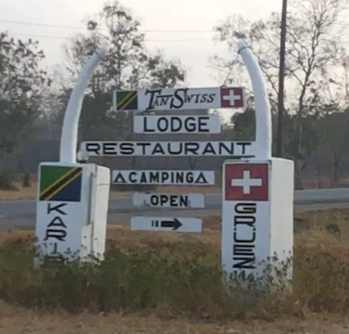 If you travel beyond the park, you'll see this Tan-Swiss Lodge Road Sign.