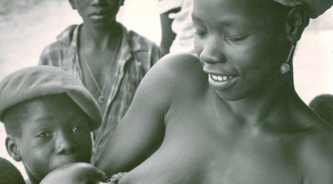 A woman feeds her child with breast milk to give him the full benefits of breastfeeding